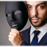 Man with mask showing he is authentic