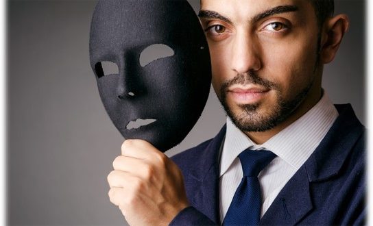 Man with mask showing he is authentic
