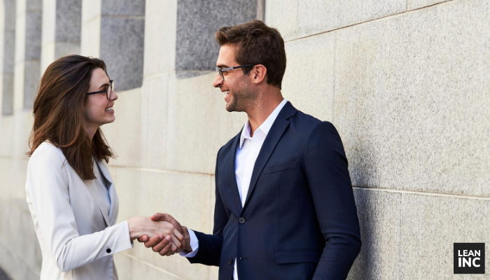 man and woman talking about a gap analysis tool